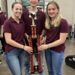 Marin Boehm, Logan Young and Olivia Terry holding the 3rd Place 2024 Nationals Trophy--Champaign Central HS
